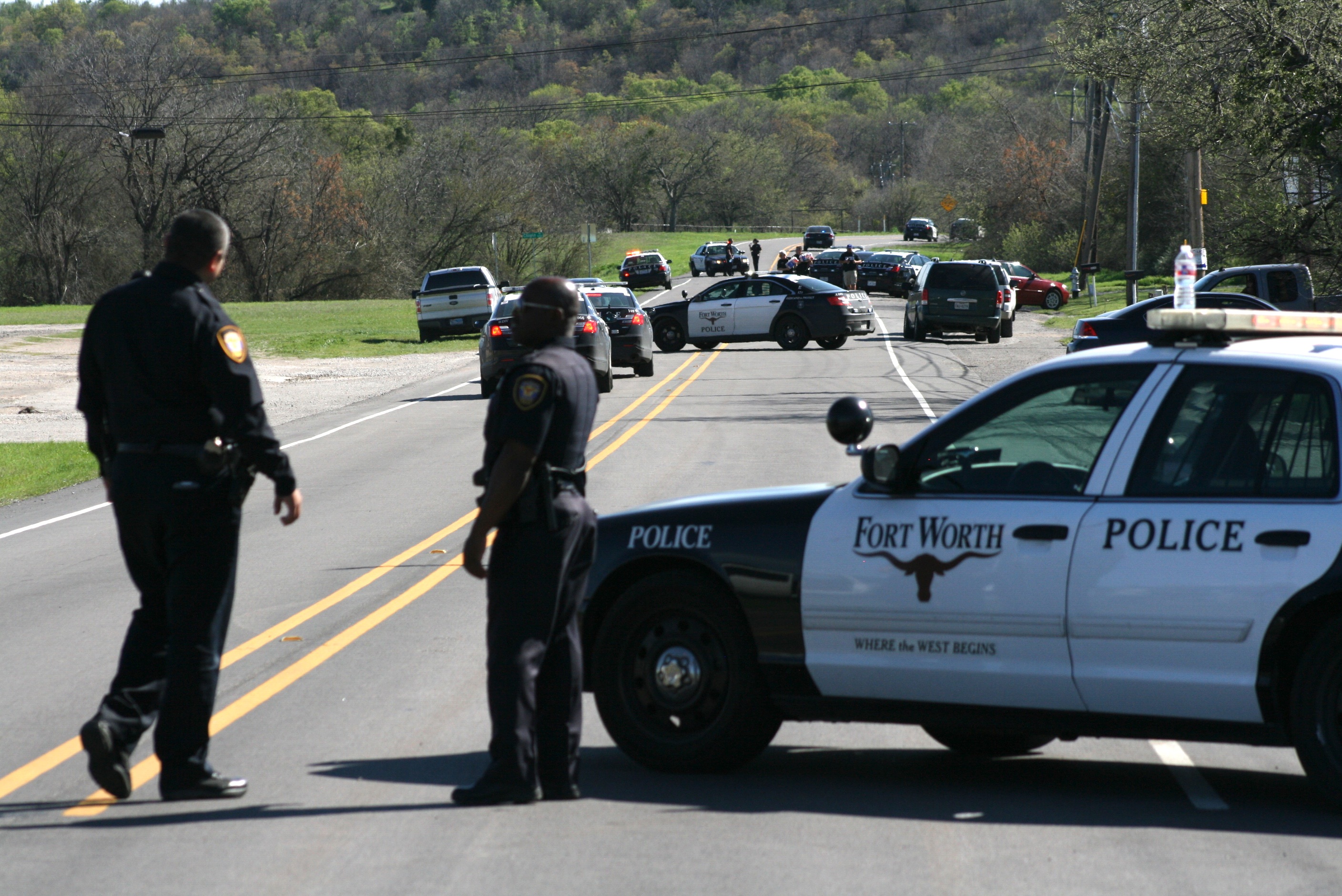 Officer shot during fugitive chase in west Fort Worth.